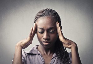 African young woman suffering from headache
