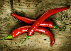 Red Hot Chili Peppers over wooden background