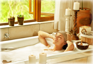 bigstock-Woman-taking-bath-happy-femal-31847432-300x207