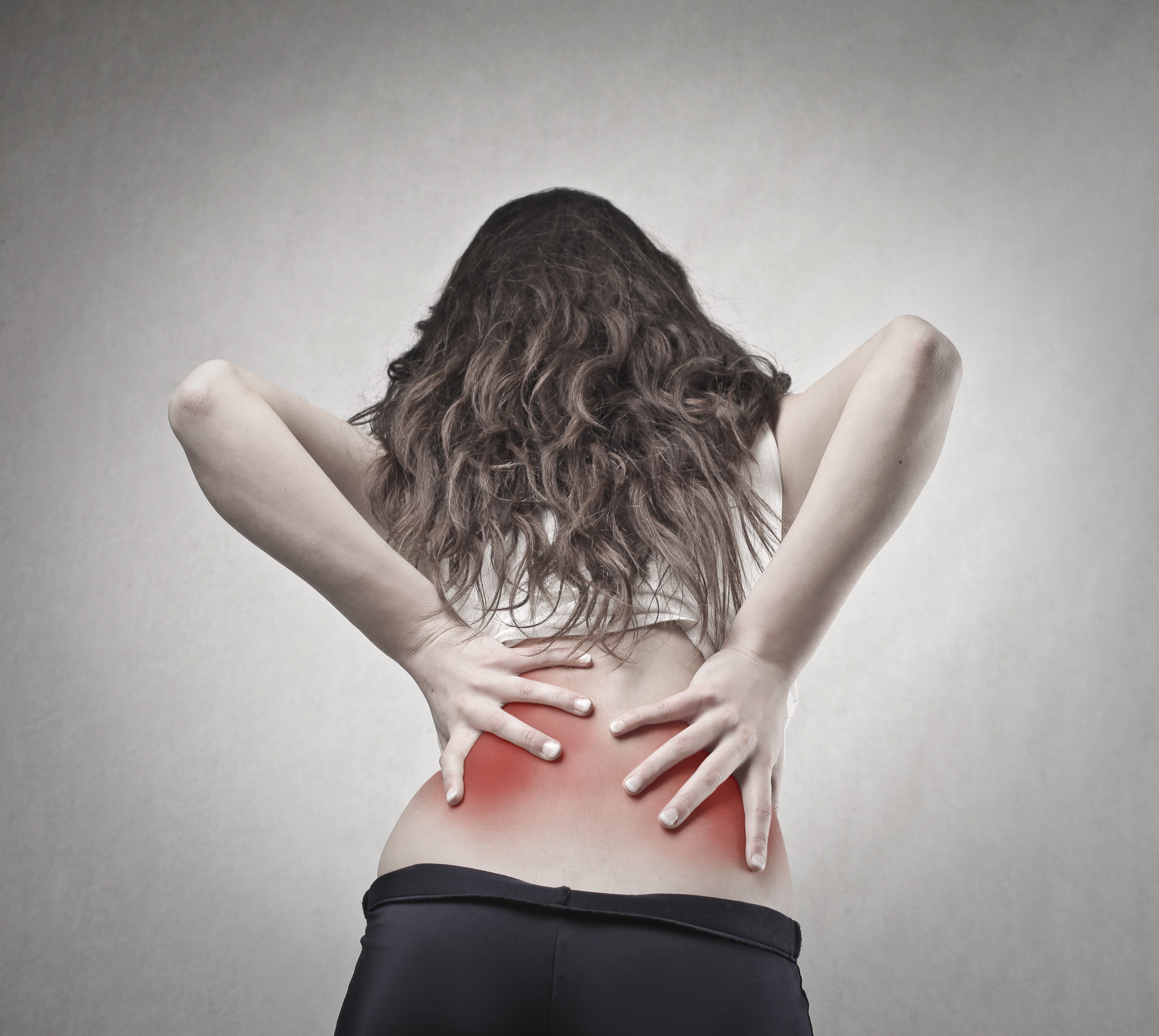 young woman with back pain