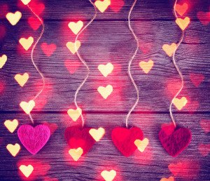 felt fabric love valentine's hearts hanging on rustic driftwood