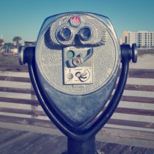 Coin binocular viewer at the beach with retro effect